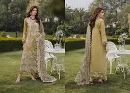 Luxury embroidered lawn suit with a heavy organza dupatta and festive gold detailing for Eid 2026.