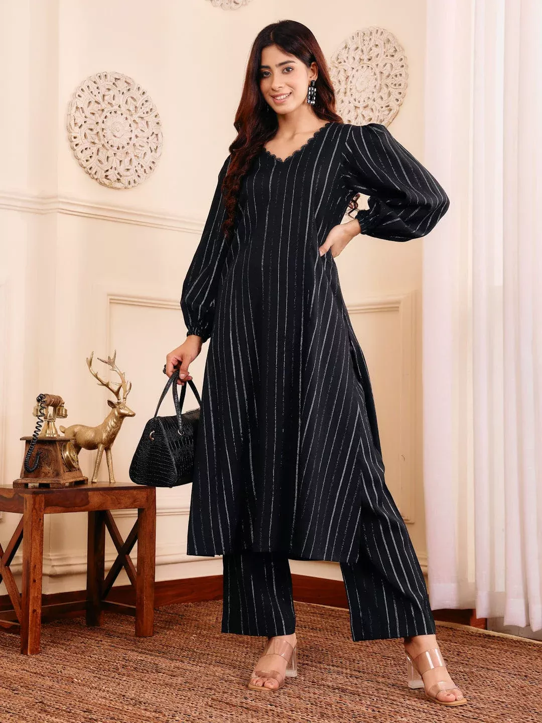 Fashionable woman wearing a loose-fit A-line kurta, straight trousers, comfort and modern style.