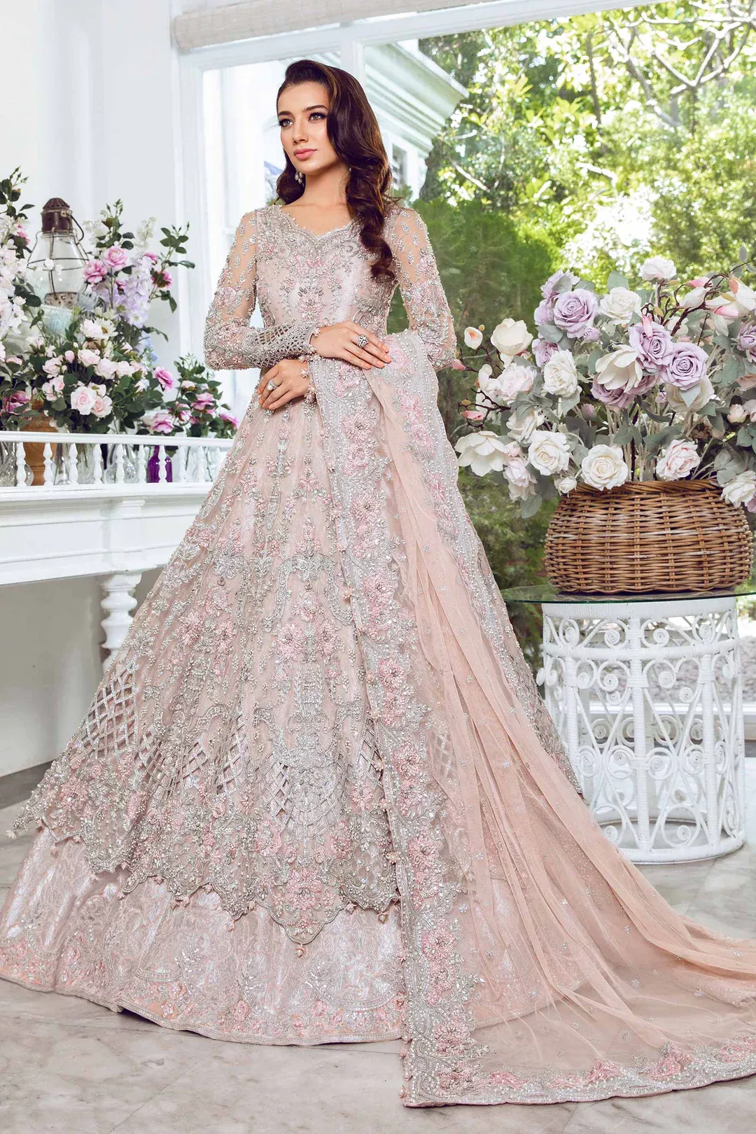 Bride in pastel walima dress with minimal embroidery and elegant styling
